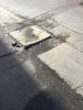 Dangerous loose concrete in laneway